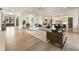 Spacious open floorplan with hardwood floors connecting the living room and modern kitchen at 2996 Treeside Ter, Marietta, GA 30066