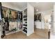 Spacious walk-in closet features custom shelving, hanging rods, and hardwood floors, perfect for organization at 2996 Treeside Ter, Marietta, GA 30066