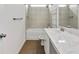 Bathroom featuring tile flooring, marble countertops, and a shower-tub combo at 3390 Meadow Grass Drive, Dacula, GA 30019