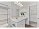 Modern bathroom features a white vanity with marble countertop and a mirrored wall cabinet at 3390 Meadow Grass Drive, Dacula, GA 30019