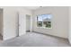 Bedroom features a view, carpeted flooring, and a closet at 3390 Meadow Grass Drive, Dacula, GA 30019