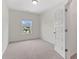 Bedroom featuring neutral walls, carpet, and a window offering natural light at 3390 Meadow Grass Drive, Dacula, GA 30019