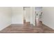 A bright, empty room with wood floors at 3390 Meadow Grass Drive, Dacula, GA 30019