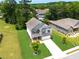 Beautifully landscaped home with a manicured lawn, long driveway, and a two-car attached garage at 3390 Meadow Grass Drive, Dacula, GA 30019
