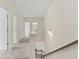 Hallway with neutral walls, carpeted floor, and doors leading to various rooms in the house at 3390 Meadow Grass Drive, Dacula, GA 30019