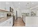 Stylish kitchen featuring white cabinets, stainless steel appliances, and granite countertops at 3390 Meadow Grass Drive, Dacula, GA 30019