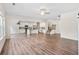 Spacious open-concept floor plan with hardwood floors, modern kitchen and a staircase at 3390 Meadow Grass Drive, Dacula, GA 30019