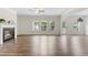 Bright living room with hardwood floors, a fireplace, and views to the outside at 3390 Meadow Grass Drive, Dacula, GA 30019
