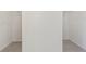 Spacious walk-in closet featuring neutral carpet and wire shelving racks at 3390 Meadow Grass Drive, Dacula, GA 30019