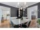 Dining room features a modern chandelier and stylish wainscotting at 46 Ivy Ne Rdg, Atlanta, GA 30342