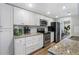 Bright kitchen featuring white cabinets, stainless steel appliances, and granite countertops at 46 Ivy Ne Rdg, Atlanta, GA 30342