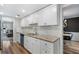 Modern kitchen featuring granite countertops, white cabinets, and stainless steel appliances at 46 Ivy Ne Rdg, Atlanta, GA 30342