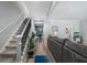 Open-concept living space with stairs and hardwood flooring, connecting the living room and kitchen at 46 Ivy Ne Rdg, Atlanta, GA 30342