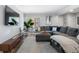 Spacious living room featuring a large sectional sofa, modern decor, and ample natural light at 46 Ivy Ne Rdg, Atlanta, GA 30342