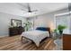 Bright main bedroom features wood floors, a dresser, and natural light at 46 Ivy Ne Rdg, Atlanta, GA 30342