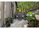 Outdoor patio with seating, charming decor, and lush greenery at 46 Ivy Ne Rdg, Atlanta, GA 30342