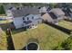 Aerial view of a home with a spacious yard, featuring a trampoline and a covered patio at 55 Clubhouse Way, Acworth, GA 30101