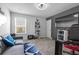 Bedroom with couch, desk, and large television at 55 Clubhouse Way, Acworth, GA 30101