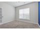 Bright bedroom with a large window and neutral carpet, creating a serene and inviting space at 55 Clubhouse Way, Acworth, GA 30101