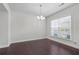 Dining room featuring hardwood floors and a hanging light fixture at 55 Clubhouse Way, Acworth, GA 30101