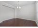Dining room featuring hardwood floors and a hanging light fixture at 55 Clubhouse Way, Acworth, GA 30101