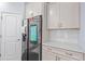 Kitchen with gray cabinets, stainless steel appliances and a smart refrigerator at 55 Clubhouse Way, Acworth, GA 30101