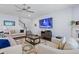 Bright living room with hardwood floors, a ceiling fan, and comfortable couches at 55 Clubhouse Way, Acworth, GA 30101