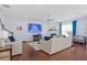 Spacious living room with hardwood floors, a fireplace, and comfortable seating arrangements with lots of natural light at 55 Clubhouse Way, Acworth, GA 30101