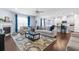 Bright and airy open-concept living room and kitchen perfect for modern living and entertaining with a fireplace at 55 Clubhouse Way, Acworth, GA 30101
