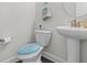 Well-maintained powder room featuring a pedestal sink and a modern toilet at 55 Clubhouse Way, Acworth, GA 30101