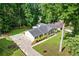 Aerial view of home showing long driveway and mature landscaping at 3210 Roseheath Ln, Lithonia, GA 30038