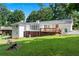 Large backyard with mature trees and deck at 3210 Roseheath Ln, Lithonia, GA 30038