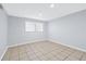 Finished basement showcases neutral walls, recessed lighting, and tiled flooring, providing versatile living space at 3210 Roseheath Ln, Lithonia, GA 30038