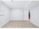 Finished basement shows a door to the stairway, neutral walls, and tiled flooring, connecting spaces at 3210 Roseheath Ln, Lithonia, GA 30038