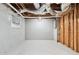 Unfinished basement with exposed pipes and ductwork, and block foundation walls, ready for customization at 3210 Roseheath Ln, Lithonia, GA 30038