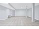 Spacious basement area with neutral walls, tiled floor and support pillars at 3210 Roseheath Ln, Lithonia, GA 30038
