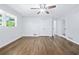 Bedroom featuring hardwood floors, ceiling fan, and a double door closet at 3210 Roseheath Ln, Lithonia, GA 30038