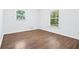 Bright bedroom with hardwood floors, neutral walls, and natural light at 3210 Roseheath Ln, Lithonia, GA 30038