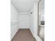 Walk-in closet featuring white wire shelves and carpeted floor at 3210 Roseheath Ln, Lithonia, GA 30038
