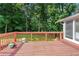 Spacious wooden deck perfect for outdoor entertaining with a view of the lush backyard at 3210 Roseheath Ln, Lithonia, GA 30038