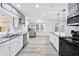 Modern kitchen with stainless steel appliances, granite countertops, and ample cabinet space at 3210 Roseheath Ln, Lithonia, GA 30038