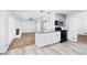 Bright and airy kitchen featuring an island with seating and seamless flow into the living area at 3210 Roseheath Ln, Lithonia, GA 30038