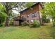 Spacious backyard with mature trees and a wooden deck, perfect for entertaining at 3352 Northbrook Dr, Atlanta, GA 30340