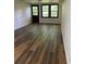 Finished basement space features wood-look flooring, door and windows at 3352 Northbrook Dr, Atlanta, GA 30340