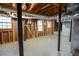 Unfinished basement with exposed beams and block foundation walls at 3352 Northbrook Dr, Atlanta, GA 30340