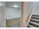 Finished basement area with new flooring and a staircase with carpet at 3352 Northbrook Dr, Atlanta, GA 30340