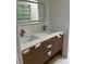 Bathroom featuring double sinks, modern vanities and backlit mirror at 3352 Northbrook Dr, Atlanta, GA 30340