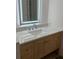 Bathroom featuring marble countertop, wood vanity and backlit mirror at 3352 Northbrook Dr, Atlanta, GA 30340