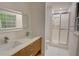 Updated bathroom featuring double sink, modern vanity and glass enclosed shower at 3352 Northbrook Dr, Atlanta, GA 30340