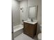 Bathroom with shower and tub combination, wood vanity and backlit mirror at 3352 Northbrook Dr, Atlanta, GA 30340